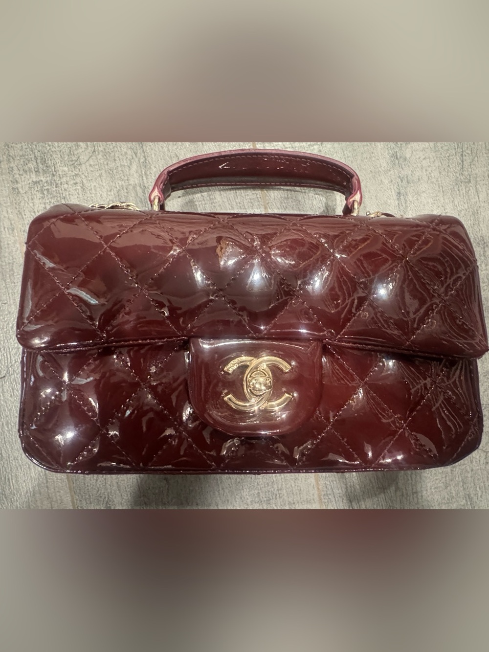 Patent quilted mini flap with top handle